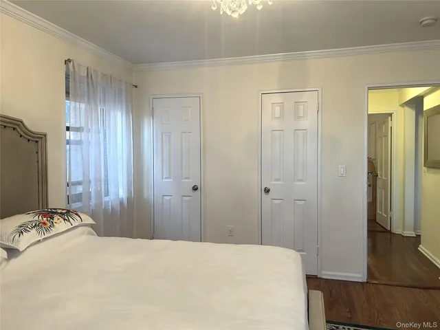 a bedroom with a bed and a closet