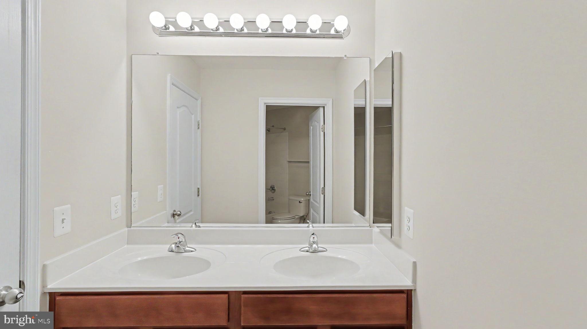 42371 Trellis Square Brambleton, VA 20148 - Photo 55 of 70 Sleek dual vanity in modern bathroom.