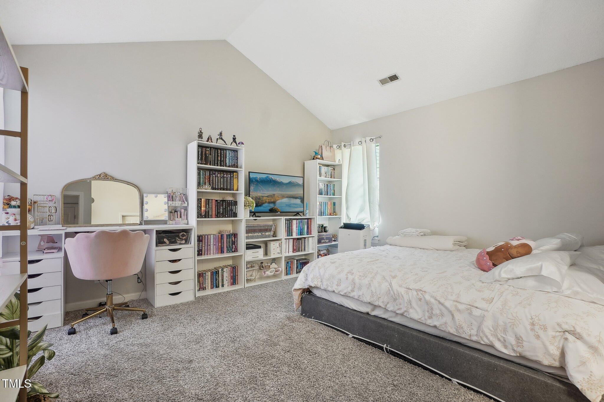 418 Devlin Place Durham, NC 27707 - Photo 11 of 19 a bedroom with a bed and a cabinets