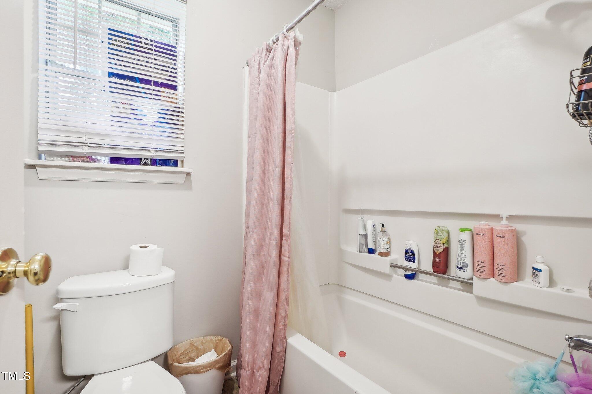 418 Devlin Place Durham, NC 27707 - Photo 14 of 19 a bathroom with a sink and a mirror