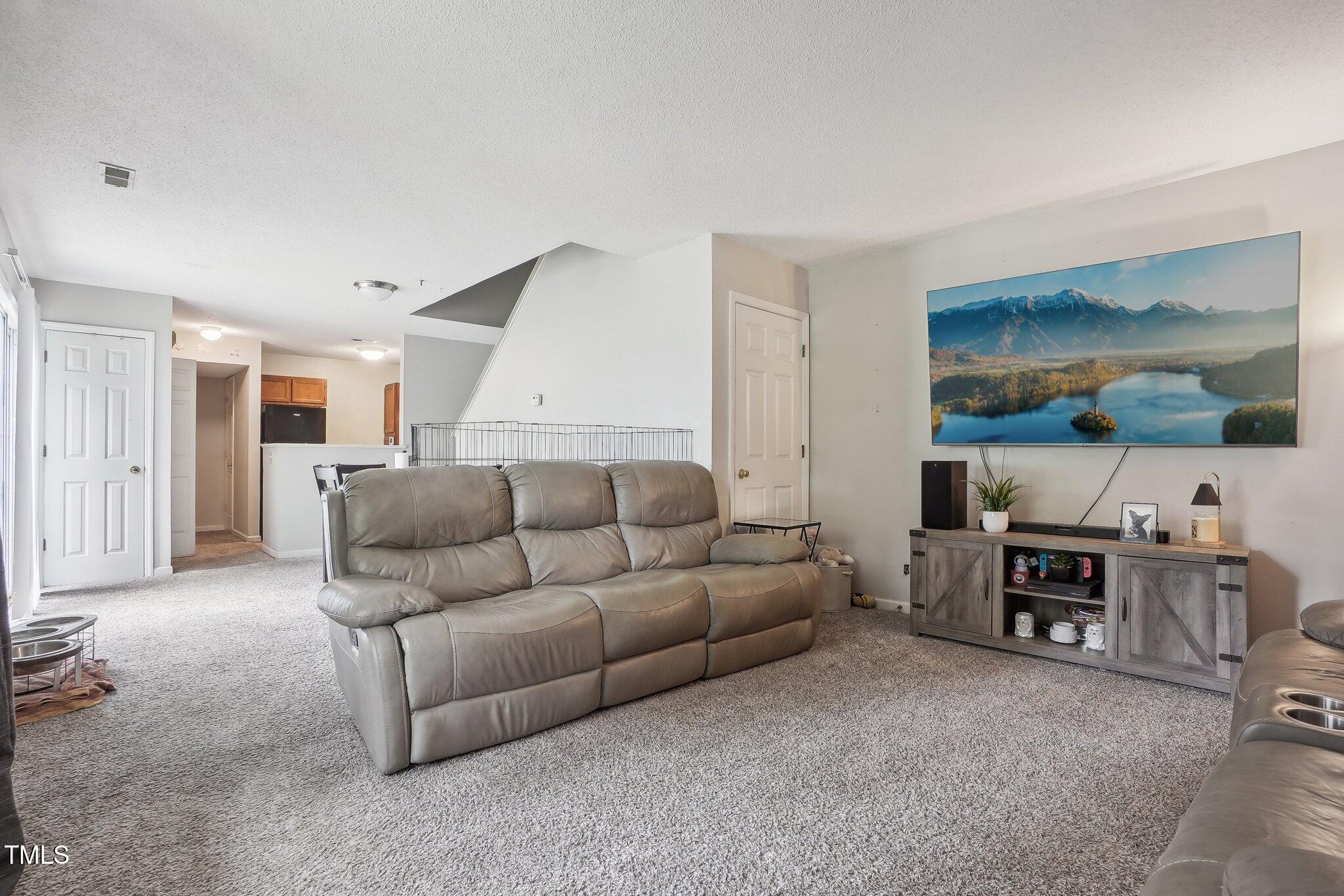 418 Devlin Place Durham, NC 27707 - Photo 2 of 19 a living room with furniture and a table