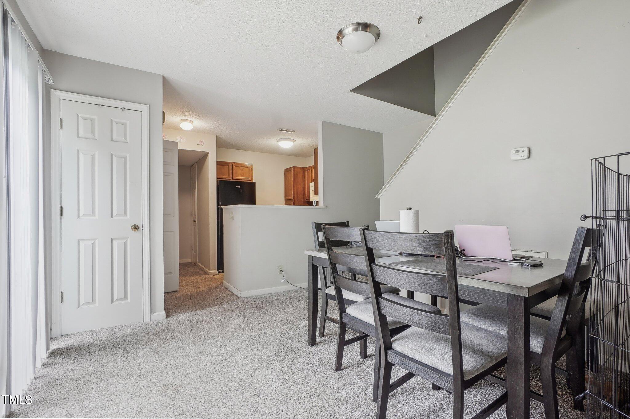 418 Devlin Place Durham, NC 27707 - Photo 4 of 19 a view of a dining room with furniture
