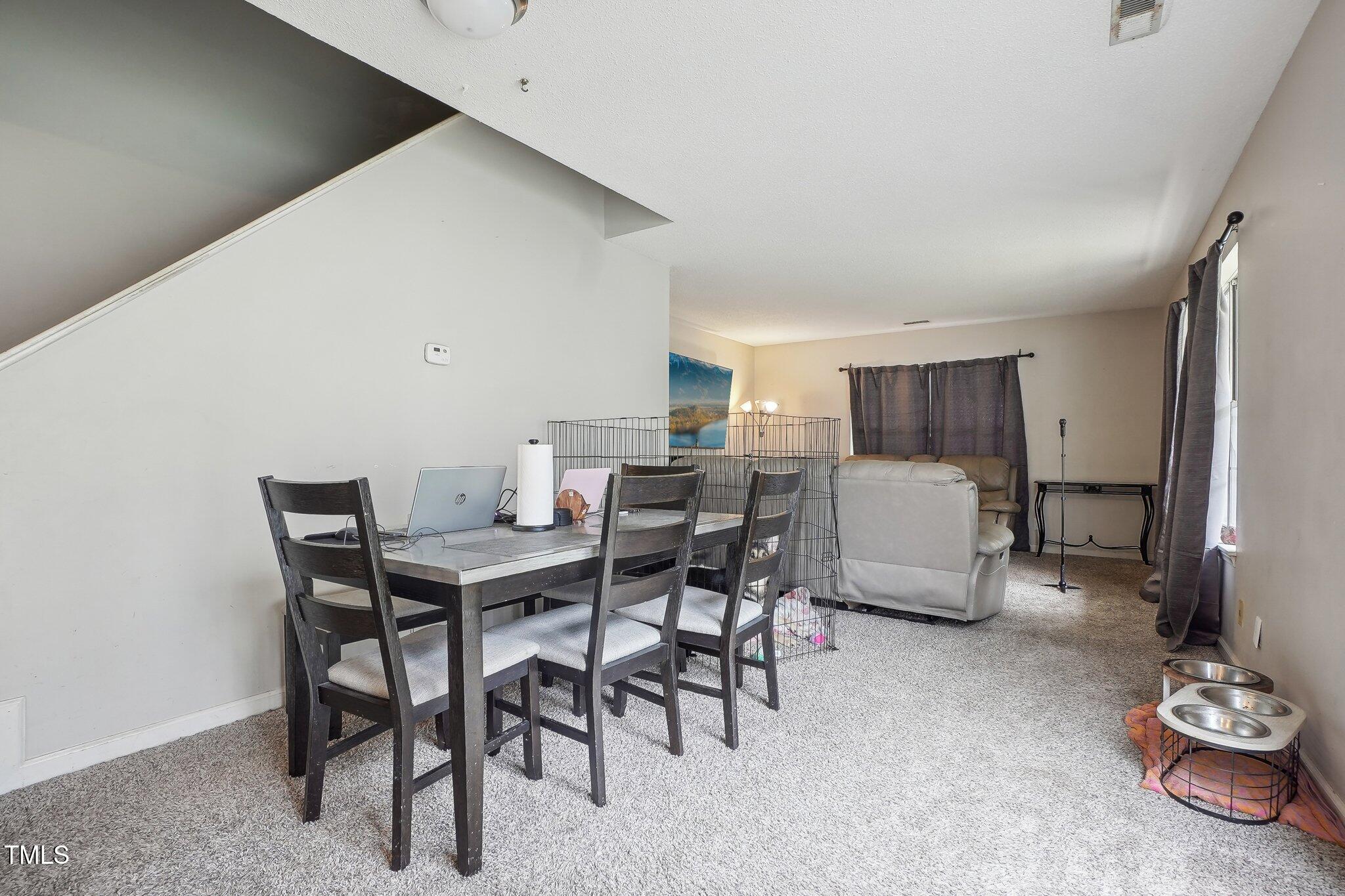 418 Devlin Place Durham, NC 27707 - Photo 5 of 19 a view of a dining room with furniture