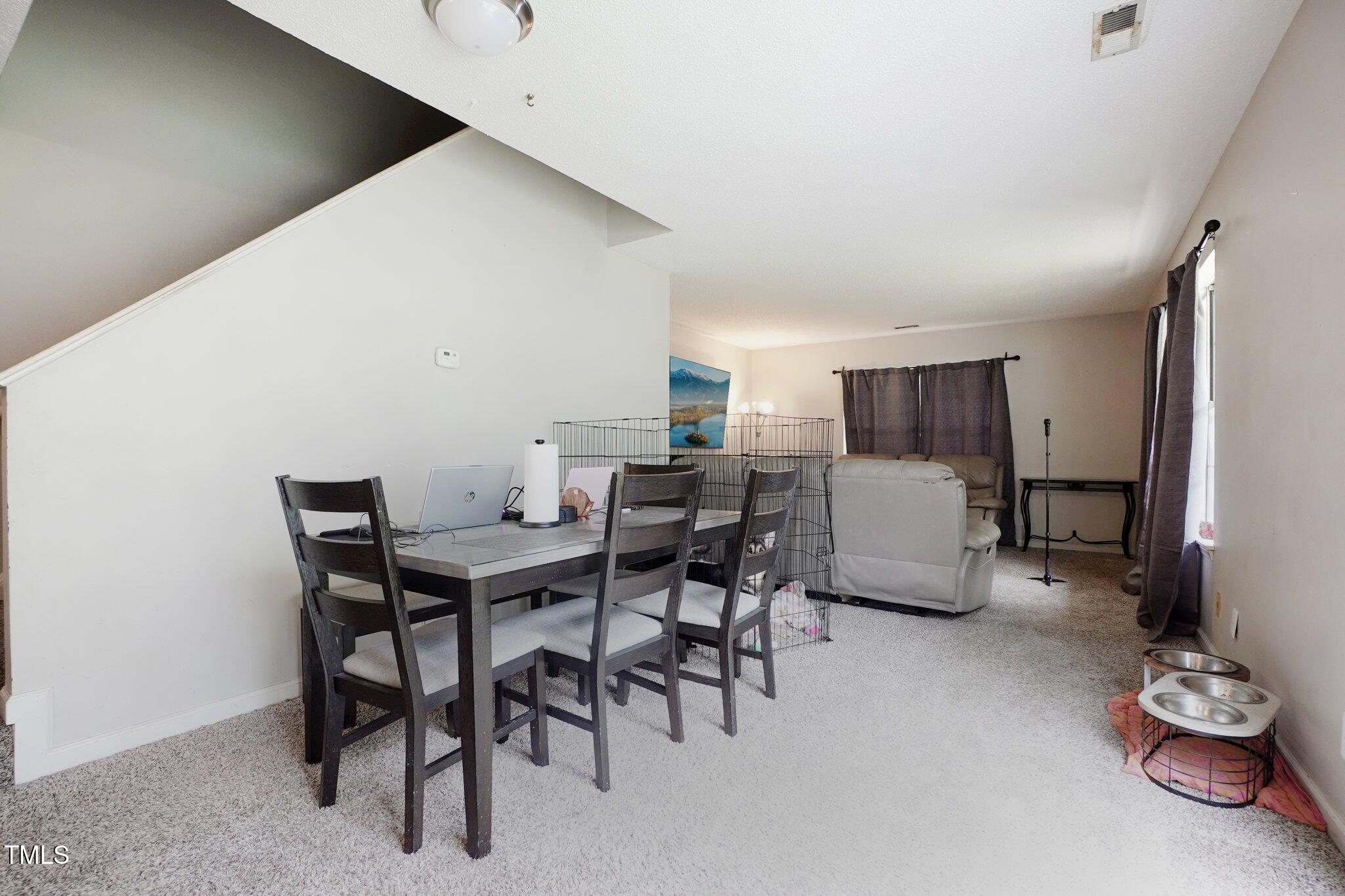 418 Devlin Place Durham, NC 27707 - Photo 6 of 19 a view of a dining room with furniture