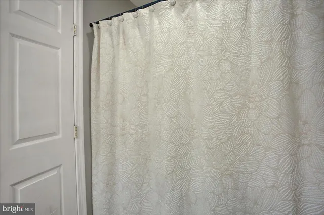 a bathroom with a shower curtain