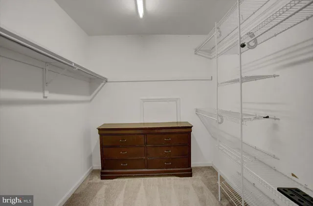 a area with a cabinets and a ceiling fan