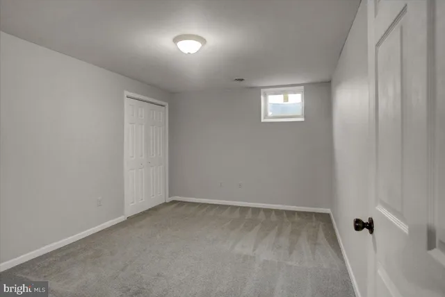 an empty room with an empty space and wooden floor