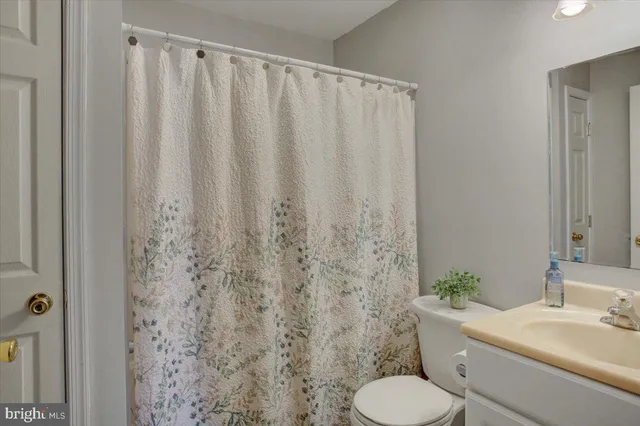 a bathroom with a toilet and a sink