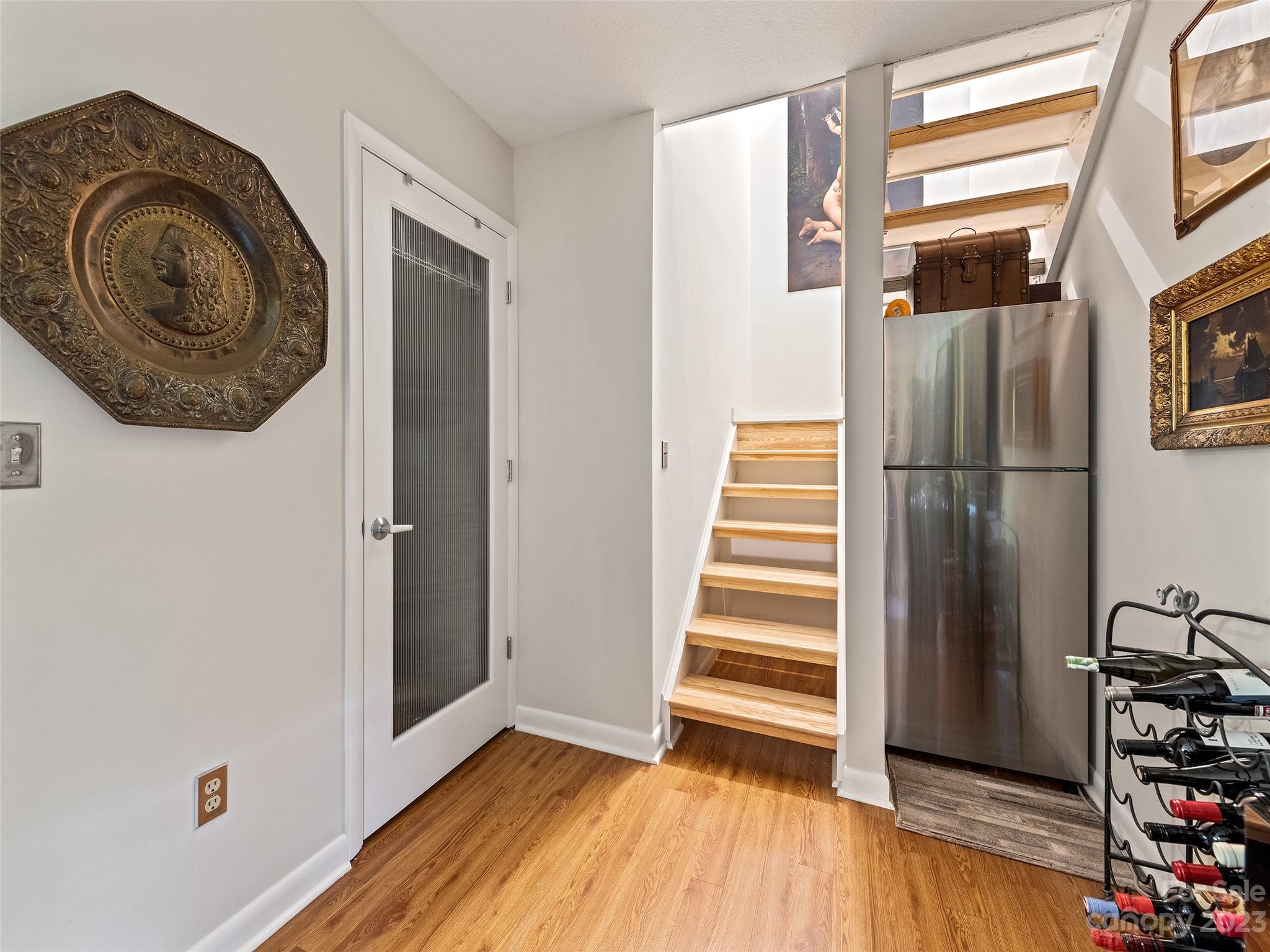 87 Willow Road, Unit C1 Waynesville, NC 28786 - Photo 23 of 48 a view of a livingroom with wooden floor and entryway