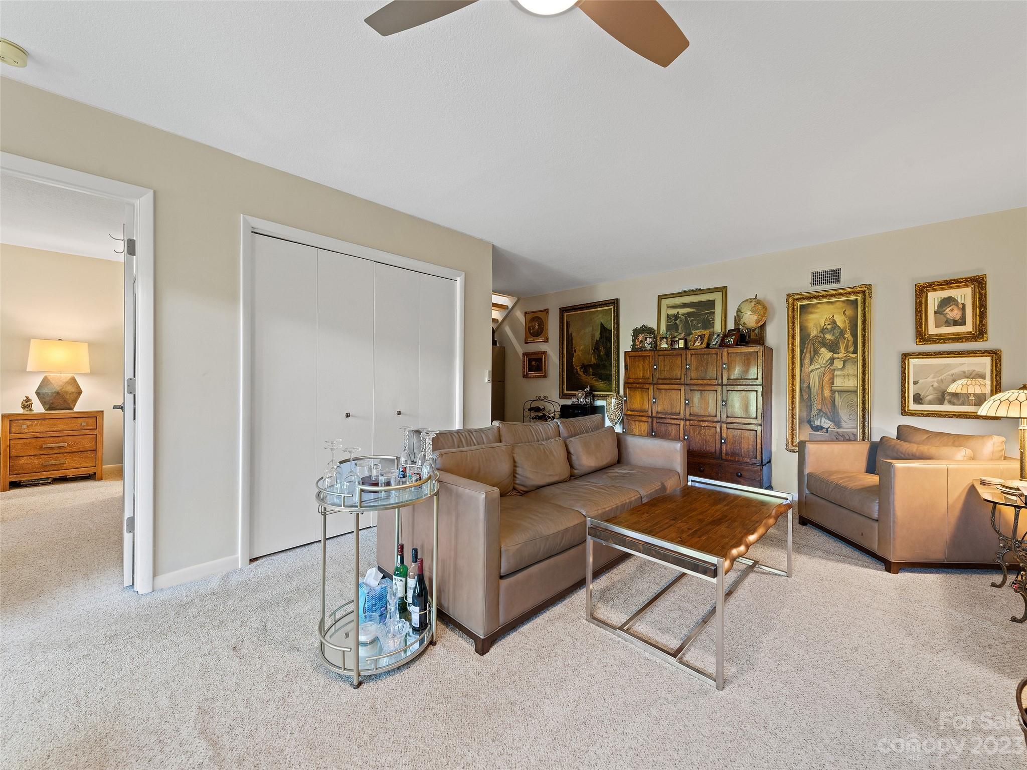 87 Willow Road, Unit C1 Waynesville, NC 28786 - Photo 27 of 48 a living room with furniture and a table