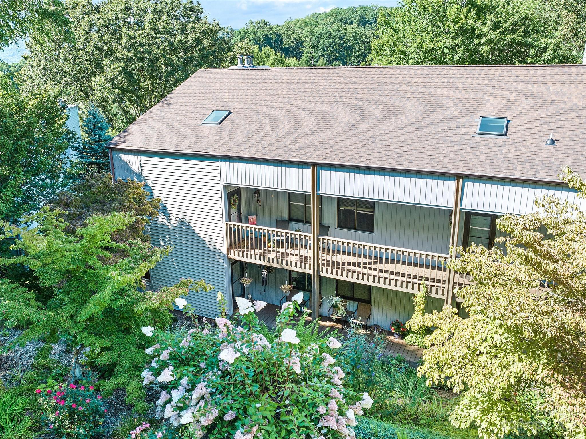 87 Willow Road, Unit C1 Waynesville, NC 28786 - Photo 38 of 48 front view of a house with a garden
