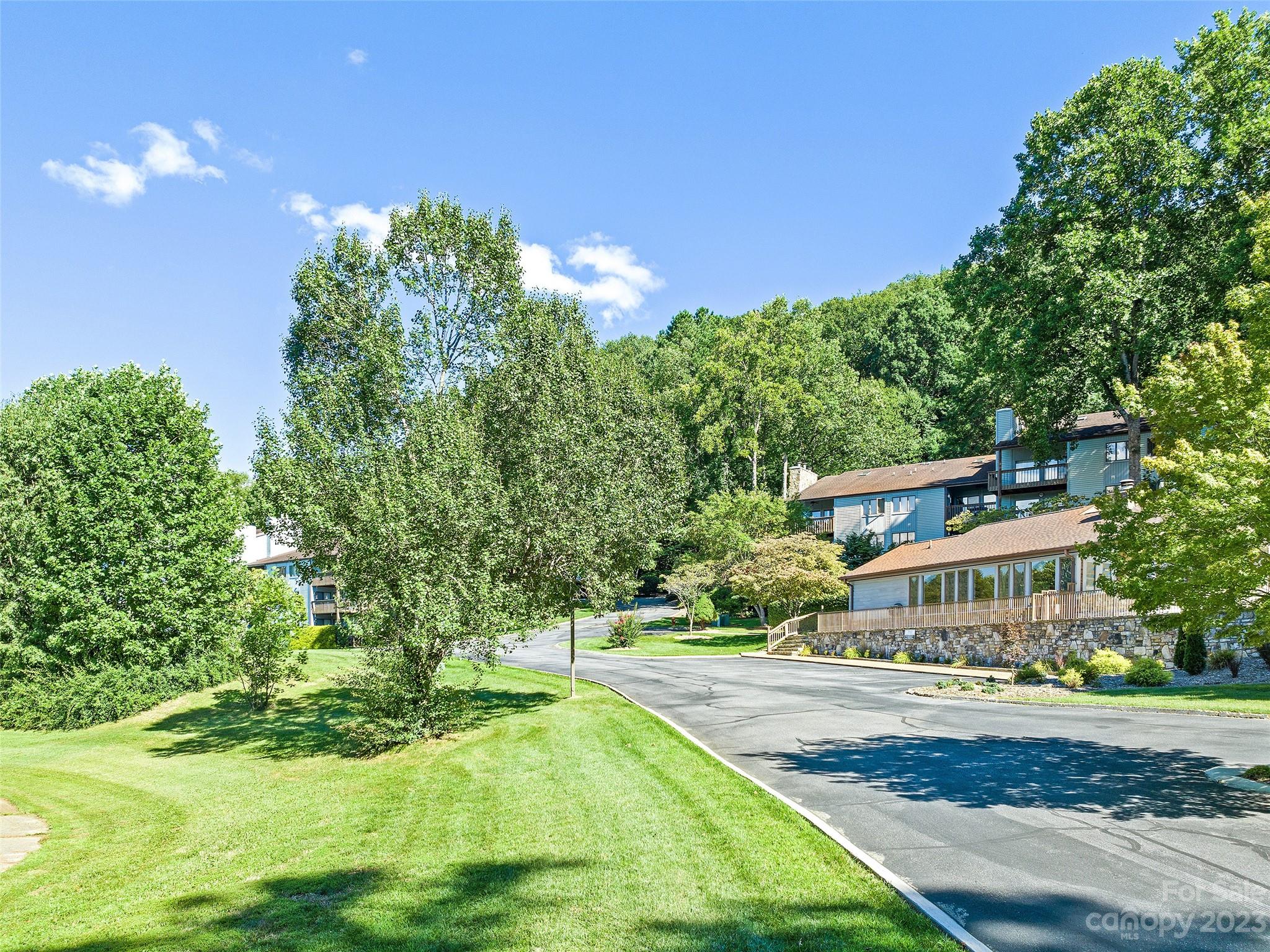 87 Willow Road, Unit C1 Waynesville, NC 28786 - Photo 45 of 48 a front view of a house with a yard