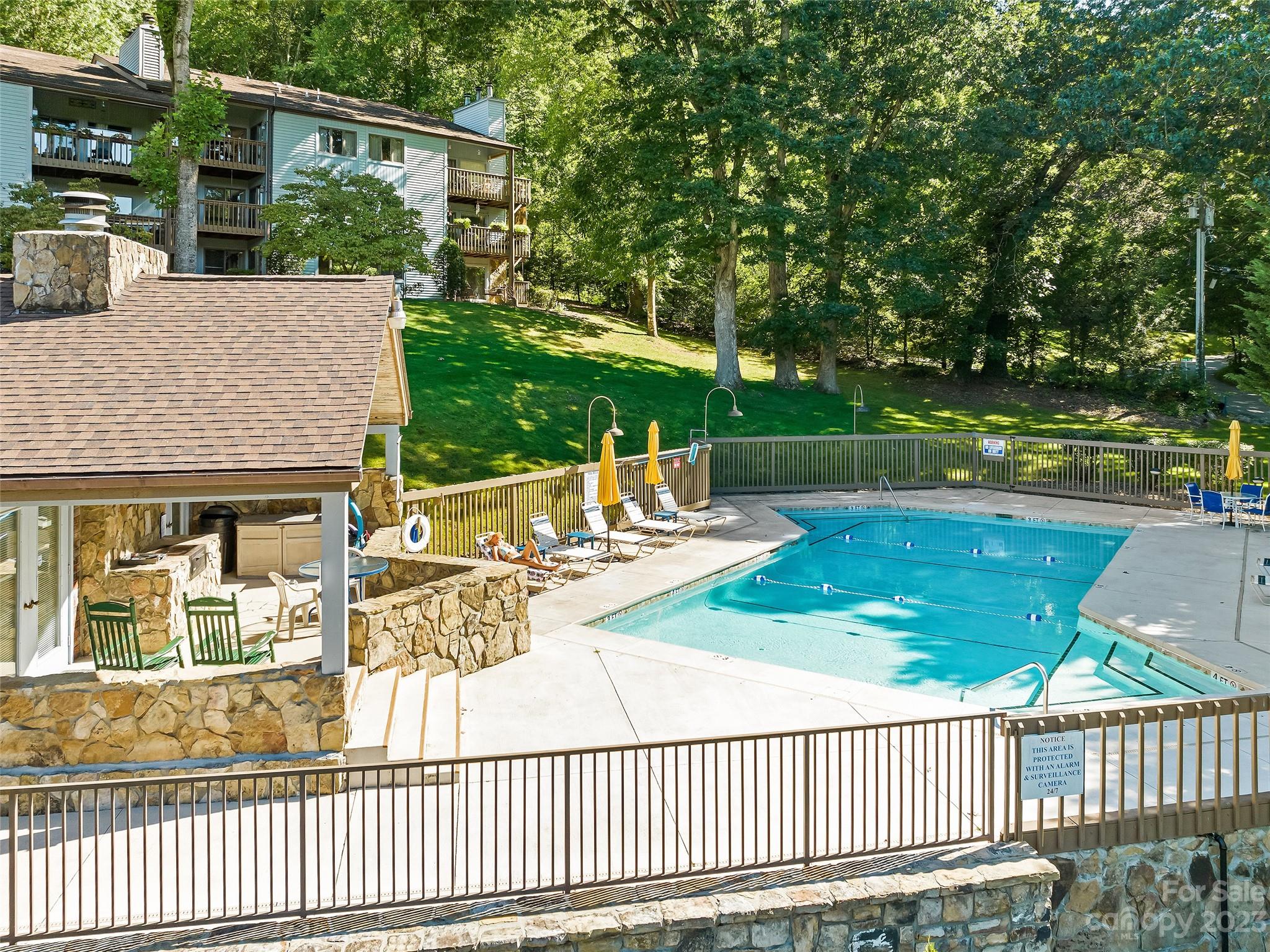 87 Willow Road, Unit C1 Waynesville, NC 28786 - Photo 47 of 48 a view of a house with backyard and sitting area