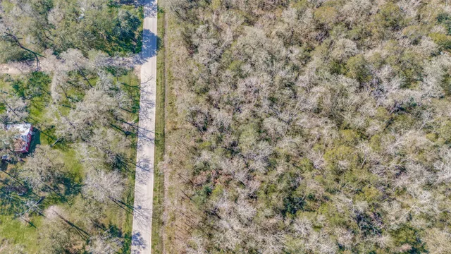 a view of a dry yard and mountain view