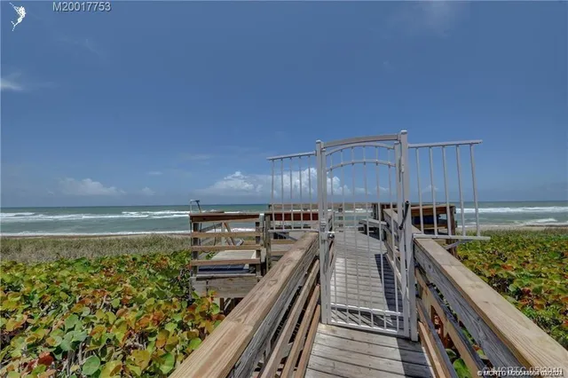 an aerial view of a city with lots of green space