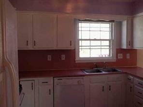 5928 Powder Horn Road Charlotte, NC 28212 - Photo 3 of 7 a kitchen with granite countertop white cabinets and sink