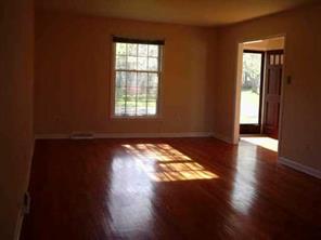 5928 Powder Horn Road Charlotte, NC 28212 - Photo 4 of 7 a view of empty room with wooden floor and fan