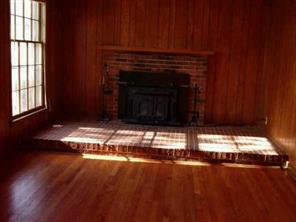 5928 Powder Horn Road Charlotte, NC 28212 - Photo 5 of 7 a view of empty room with fireplace and window