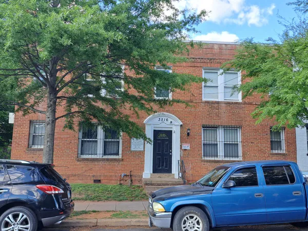 a front view of a house with parking space