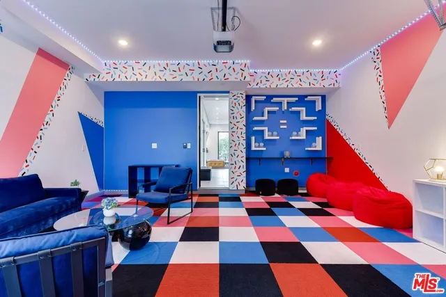 a view of a kitchen with kitchen island granite countertop a sink and a large window