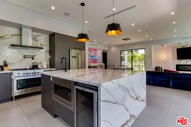 a bathroom with a toilet sink and shower