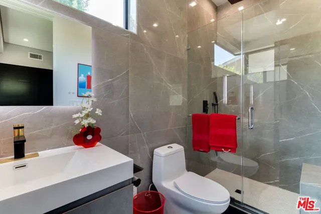 a view of staircase with white walls and a table