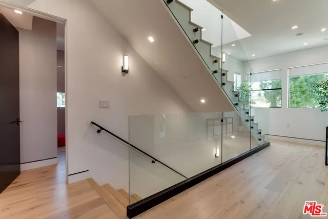 view of a hallway with wooden floor