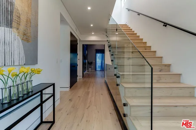 a white toilet sitting next to a white walls