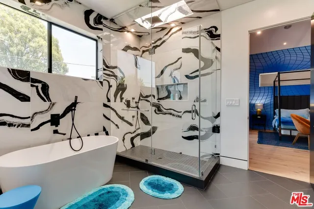 a bathroom with a sink and mirror