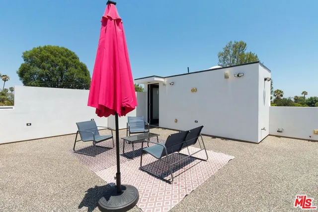 a view of white house with yard