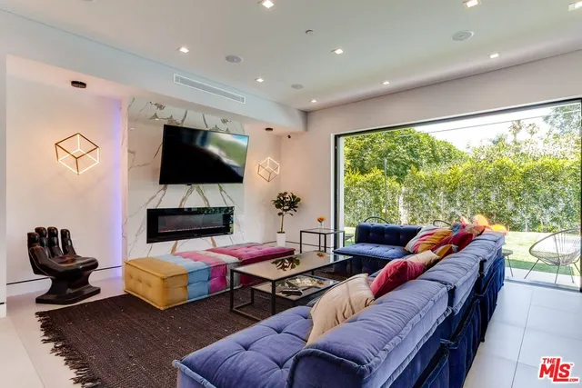 a living room with furniture and a rug