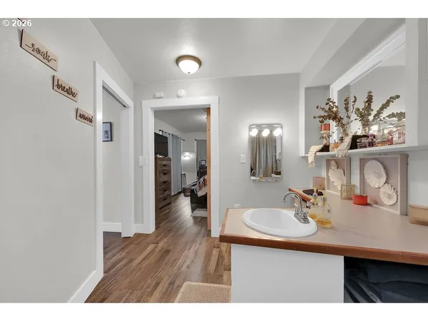 a bathroom with a sink and a mirror