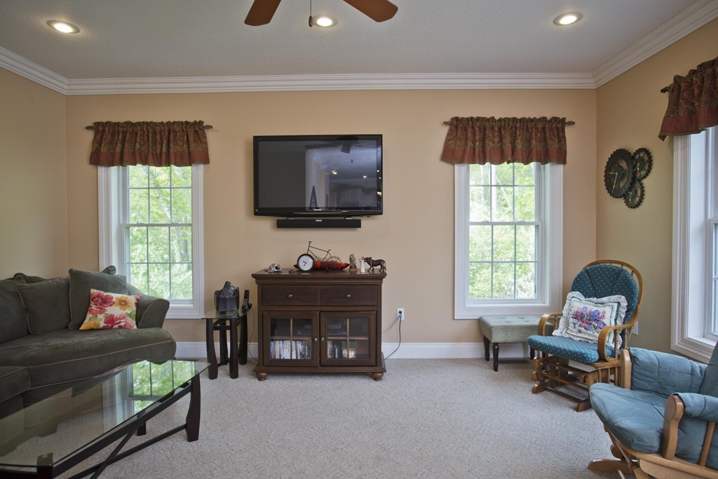 676 Old Warren Road Palmer, MA 01069 - Photo 13 of 30 a living room with furniture and a flat screen tv