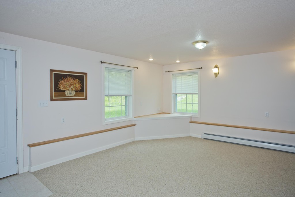 676 Old Warren Road Palmer, MA 01069 - Photo 18 of 30 a view of an empty room with a window