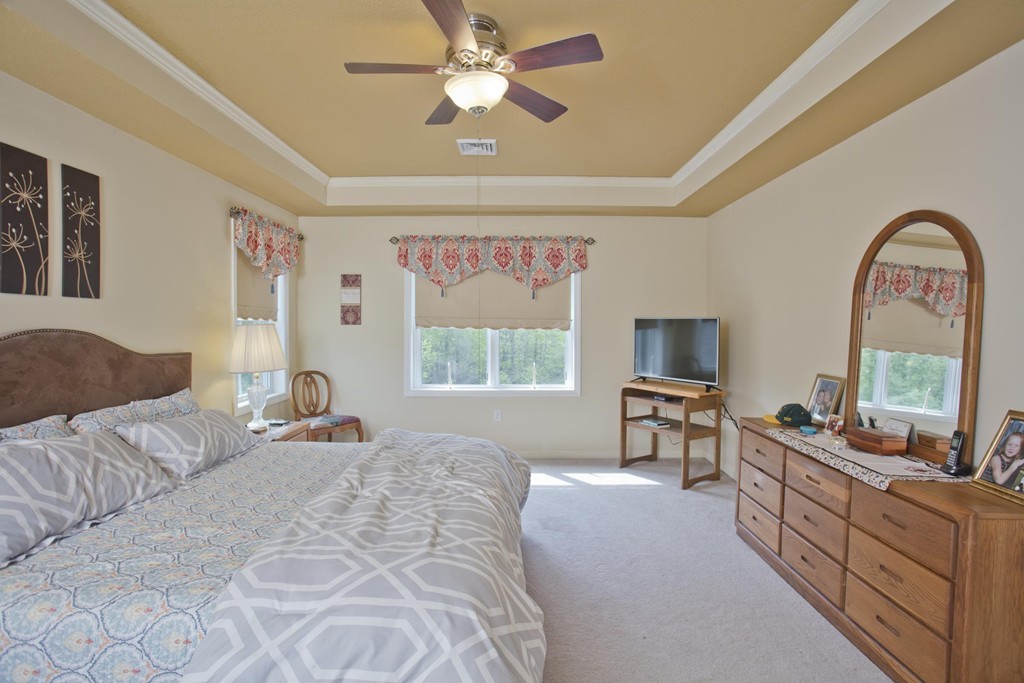 676 Old Warren Road Palmer, MA 01069 - Photo 20 of 30 a large bedroom with a bed and a large window with the outer view