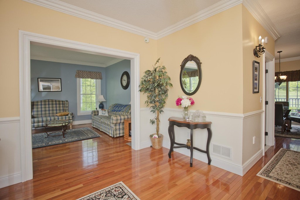 676 Old Warren Road Palmer, MA 01069 - Photo 2 of 30 a living room with furniture and a wooden floor