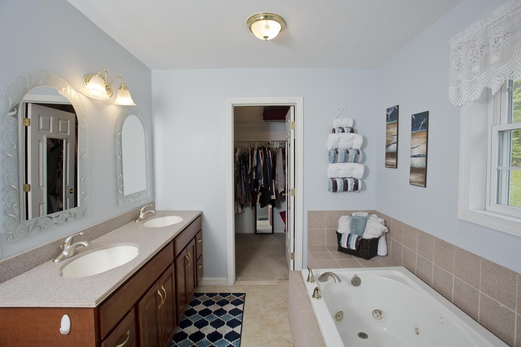 676 Old Warren Road Palmer, MA 01069 - Photo 22 of 30 a bathroom with a sink and a bathtub