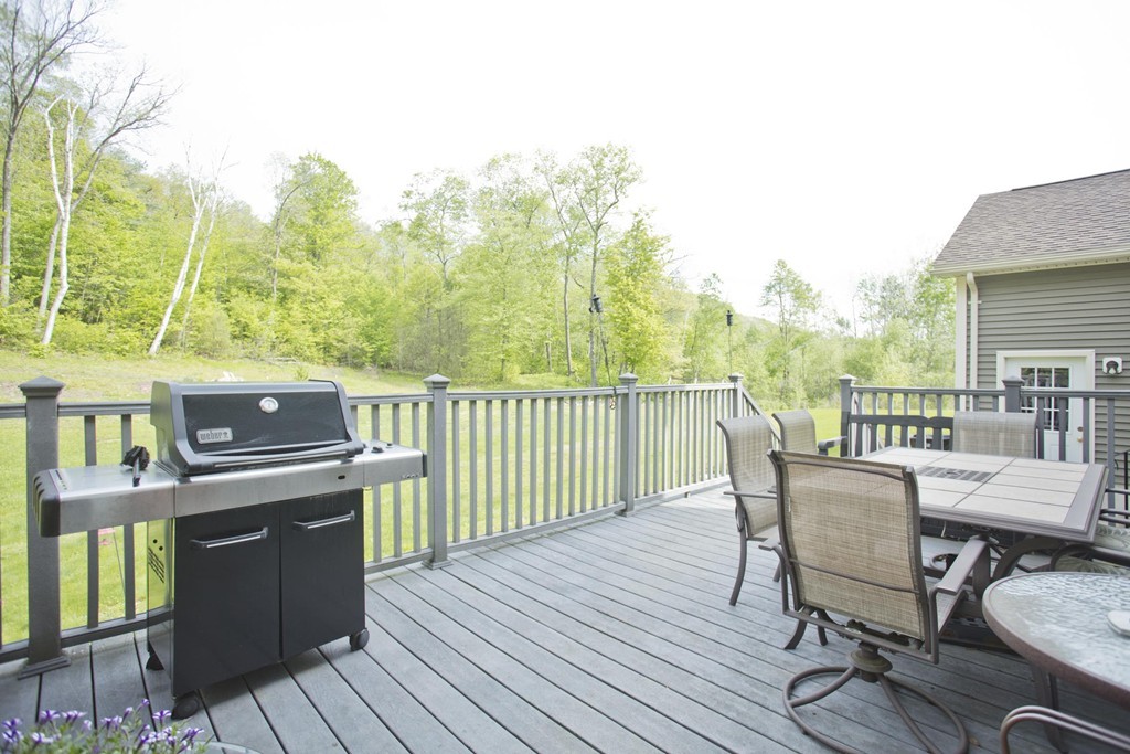 676 Old Warren Road Palmer, MA 01069 - Photo 27 of 30 a view of a balcony with furniture