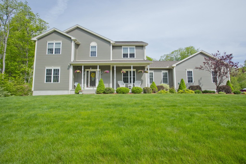 676 Old Warren Road Palmer, MA 01069 - Photo 29 of 30 a front view of house with yard and green space