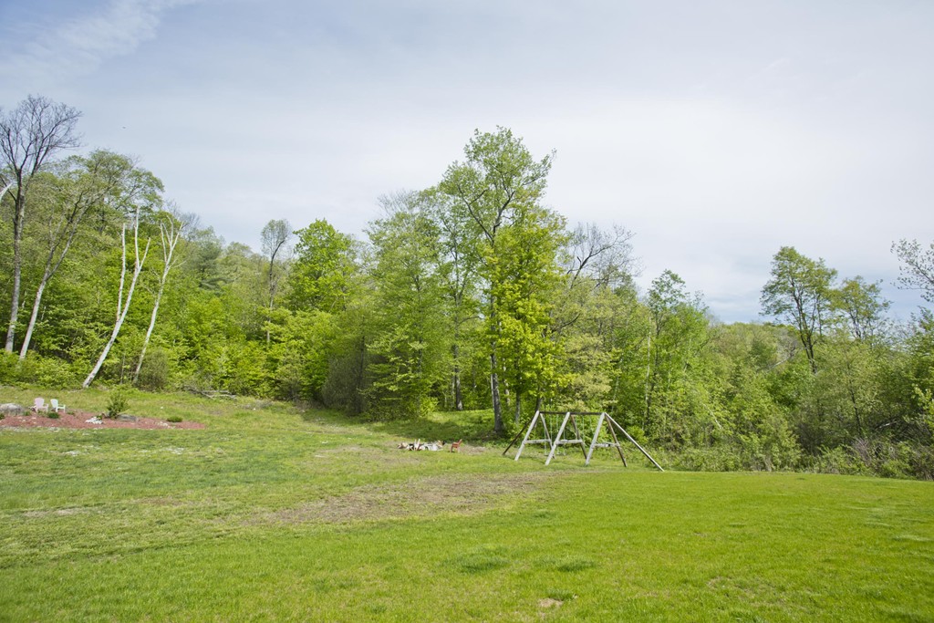 676 Old Warren Road Palmer, MA 01069 - Photo 30 of 30 a view of a golf course with a trees