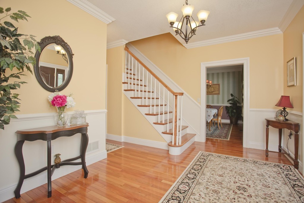 676 Old Warren Road Palmer, MA 01069 - Photo 4 of 30 a view of a dining room with furniture and a chandelier