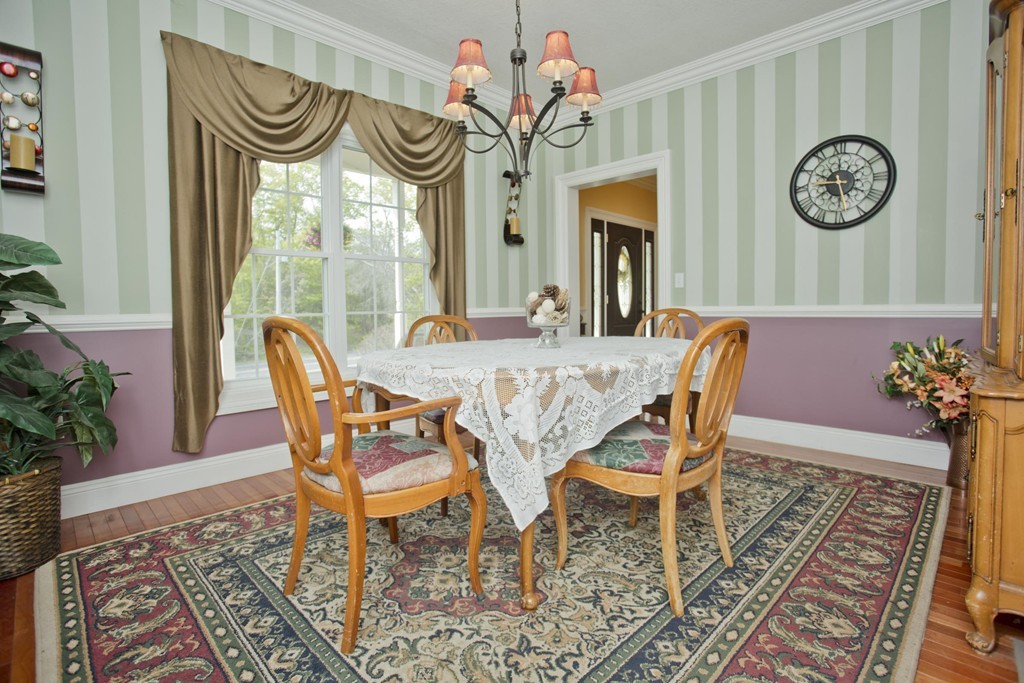 676 Old Warren Road Palmer, MA 01069 - Photo 6 of 30 a view of a dining room with furniture window and wooden floor