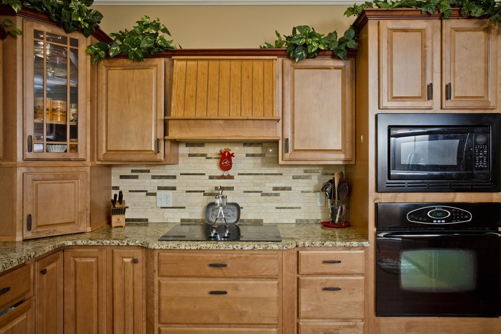 676 Old Warren Road Palmer, MA 01069 - Photo 9 of 30 a kitchen with granite countertop a sink and cabinets