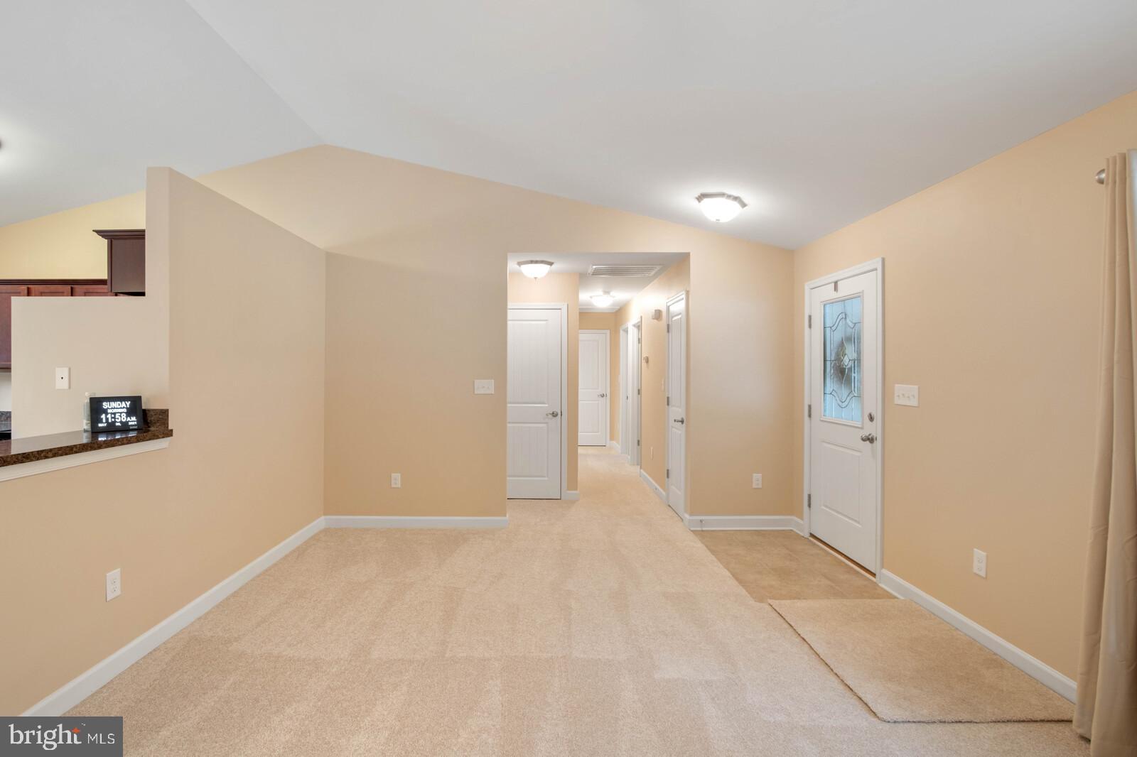 219 Rolando Drive Colonial Beach, VA 22443 - Photo 9 of 43 Vaulted ceiling in the living room and kitchen.