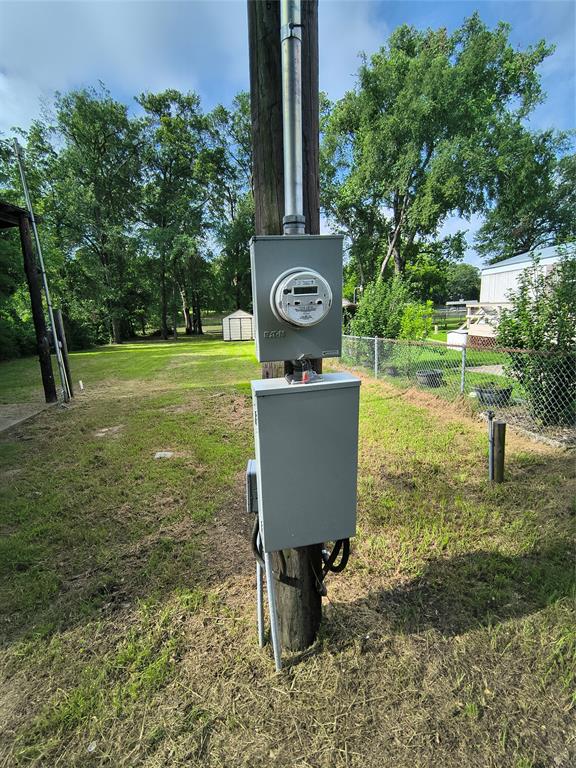180 Arrowhead Street Mabank, TX 75156 - Photo 9 of 26 a backyard of a house with yard and outdoor seating
