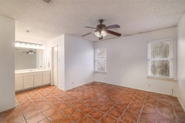 a big room with windows and closet