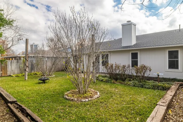 a house view with a garden space