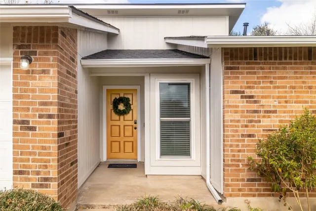 a front view of a house with a garage
