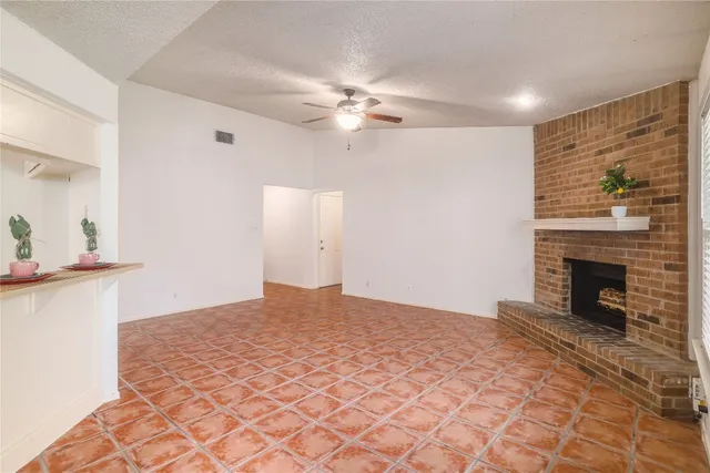 a bedroom with a bed and a fireplace