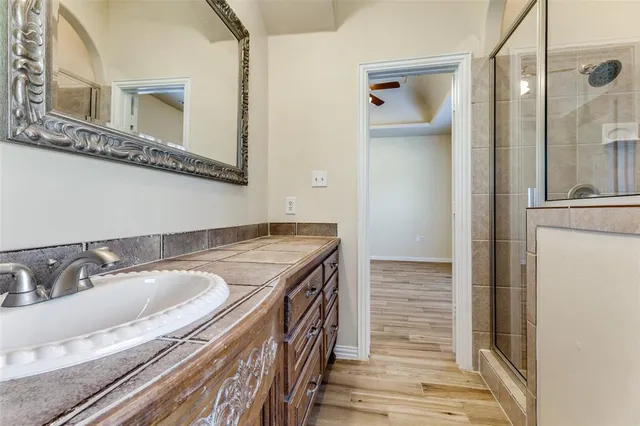 a bathroom with a sink and a mirror